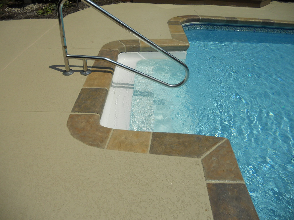 Concrete patio and swimming pool